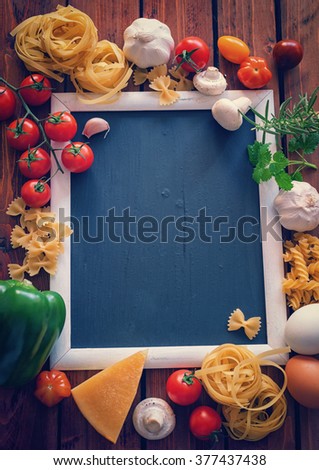Ingredients for cooking on an old wooden background