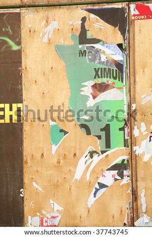 surface of the billboard with scrap of the paper announcements and posters