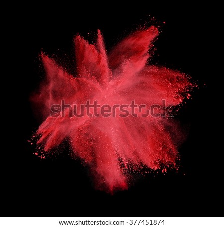 Red colorful powder splash on black background