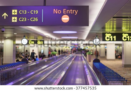 Signs in airport with blured background