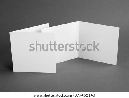 White empty  card on grey to replace your design