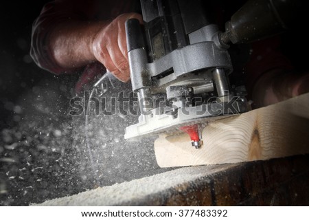 drill machine drilling a wood board Royalty-Free Stock Photo #377483392