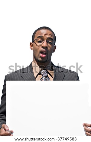A young business man holds up a blank white sign with copyspace.