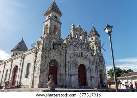 Granada - the colonial oldest Spanish city in Nicaragua has trim churches, the fine palm-covered plaza, and the colorful architecture. The picture present Guadalupe churc
