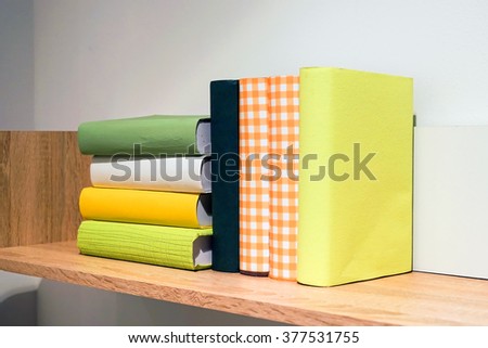 Books on the shelf, white and green