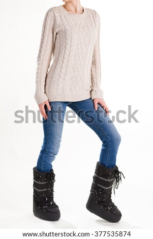 Comfortable winter fashion women's clothing. Warm winter boots.