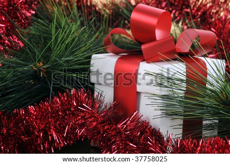 Christmas present with red ribbon close up