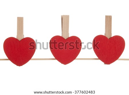 Love for Valentine's day - Red hearts hung together on the rope 