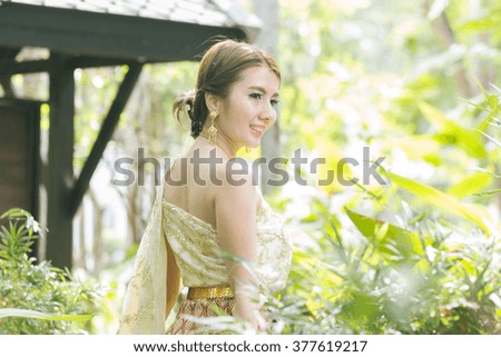 Portrait of beautiful Thai woman in Thai traditional costume,thai dress,Thai women wearing typical Thai dress, identity culture of Thailand