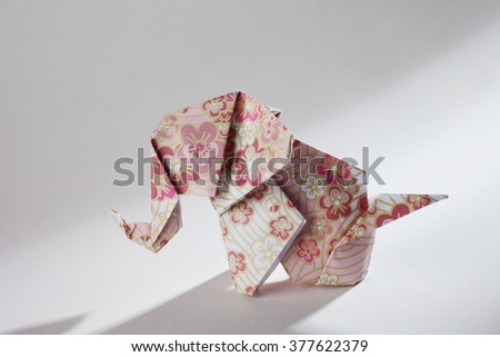 Cute floral origami elephant  isolated on white background 