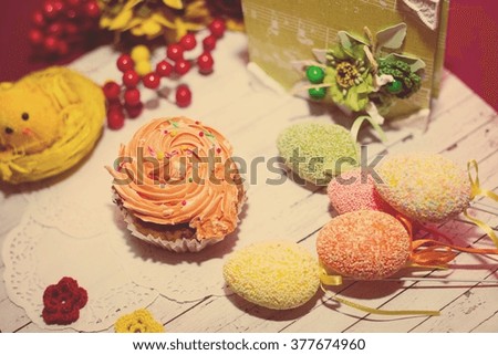 Cake, colorful eggs and gift decorations