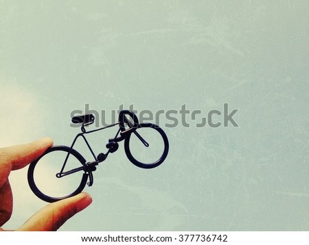 Toy bike and sky background, process vintage tone