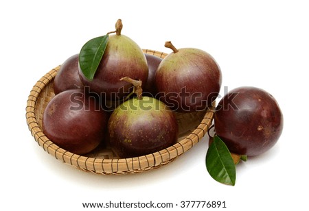 purple star apple fruits with leaf isolated on white background