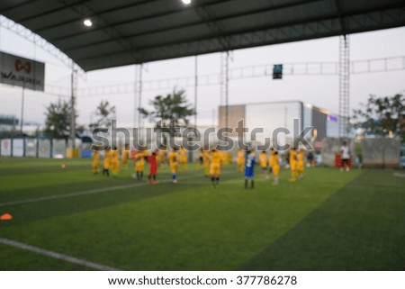 Blurred of young kids playing a youth soccer match