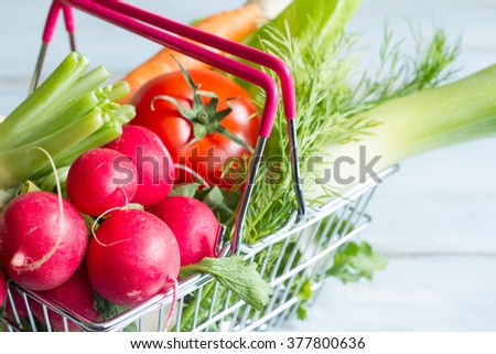 Spring vegetables in shopping basket