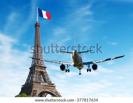 Airplane over Paris, France. Tourism and vacation concept                 