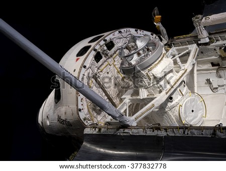 Shuttle Atlantis showing pay load bay at Cape Canaveral, Kennedy Space Center with black background. Elements of this image furnished by NASA. Royalty-Free Stock Photo #377832778