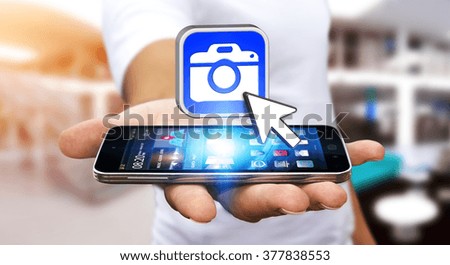 Young man with modern mobile phone in his hand using modern camera application