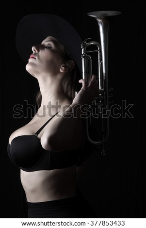trumpet and a woman - musical instrument - beautiful young woman - shadows - valves and tubes