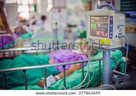ICU room in a hospital with medical equipments and patient. Royalty-Free Stock Photo #377863699