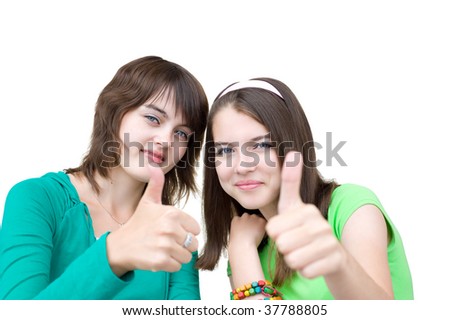 young beautiful smiling european girls look into camera and show their thumbs up