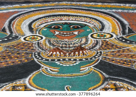 Ritualistic art kalam/ dhulee chithram/ powder drawing in Wayanad, Kerala, India. temple art drawing, floor canvas. Traditional way to worship and propitiate gods Kaali, Ayyappan or Vettakkorumakan. 
