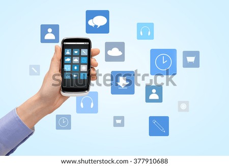 people, technology and media concept - close up of woman hand with smartphone with application icons on screen