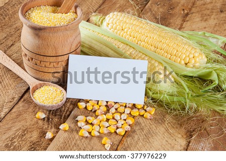 Photo of business cards. Template for branding identity. For graphic designers presentations and portfolios. With corn on wooden background. Subject agronomist, agriculture
