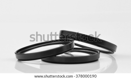 three photographic optical filters on neutral background