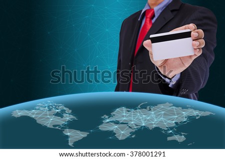 business man holding smart card with world map