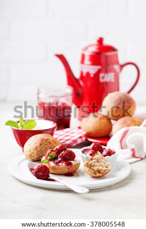 Wholegrain buns and chia seeds strawberry jam for breakfast, selective focus