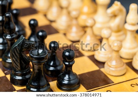 Close up of chess pieces on the board, shallow depth of field