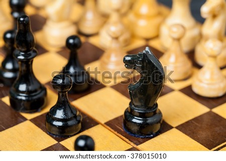 Close up of chess pieces on the board, shallow depth of field