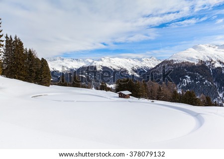 Beautiful view of the alps from Schatzalp in winter on a sunny day, Davos, Canton of Grisons, Switzerland.