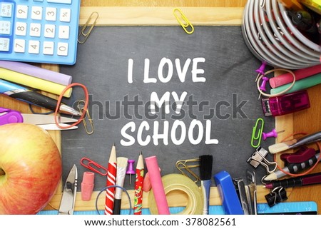school supply on small blackboard with i love my school words