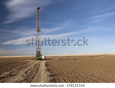 Fracking rig in a Colorado field Royalty-Free Stock Photo #378131164
