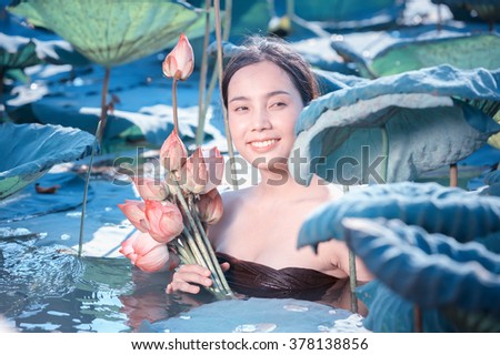 amezing of beautiful young woman Farmer  collecting lotus in garden. thai lifestyle  people in local,Thailand, vintage filter effect