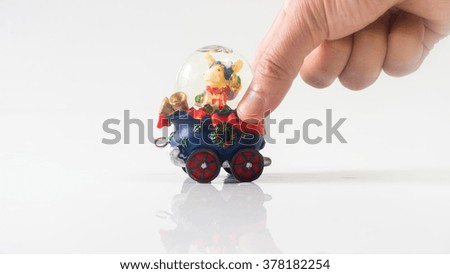 Christmas snow-globe of reindeer on santa claus cart. Concept of christmas holiday present. Isolated on empty background. Slightly de-focused and close-up shot. Copy space.