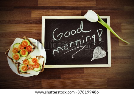 Delicious sandwich, white rose and a blackboard with written text: "Good morning!" Image includes a effect.