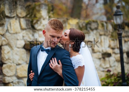wedding beautiful young couple stand on background forest