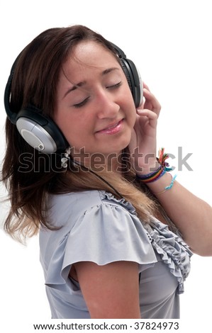 Young latin girl listening music very happy and cheerful.