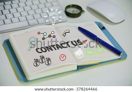 drawing contact us concept on notebook in the office , business concept , business idea