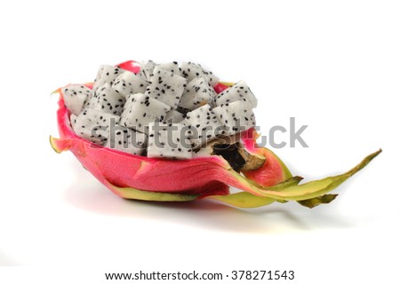 Close up diced dragon fruit pieces in the shell isolated on white background 