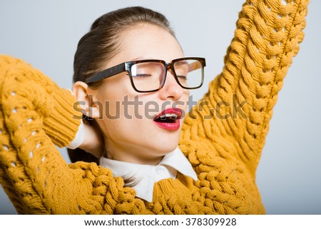 successful woman stretching after sleeping with glasses isolated in the studio