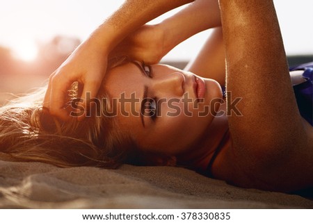 The girl's face. Girl on the beach. Blue dress. Royalty-Free Stock Photo #378330835