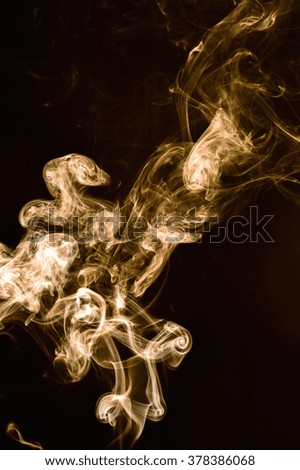 Brown smoke abstract on black background.