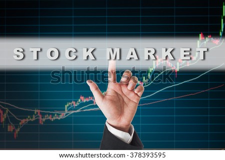 businessman touching stock market  text on  touch screen interface with stock graph background
