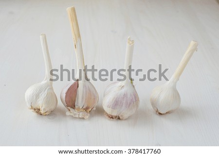 Garlic on a light wooden background 