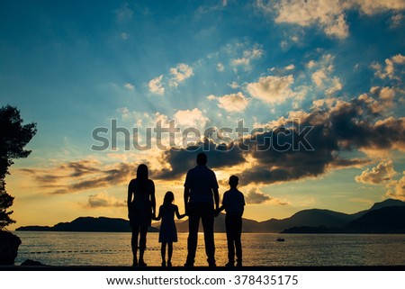 Family silhouette in the sunset