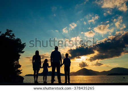 Family silhouette in the sunset